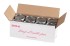 Open box holding eight maple syrup cans open box of 8 maple syrup cans, metal syrup cans, cardboard can case, maple syrup packaging, top view